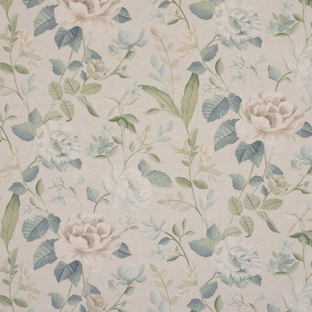 Mint green floral embroidered fabric with pale blooms on a light ground