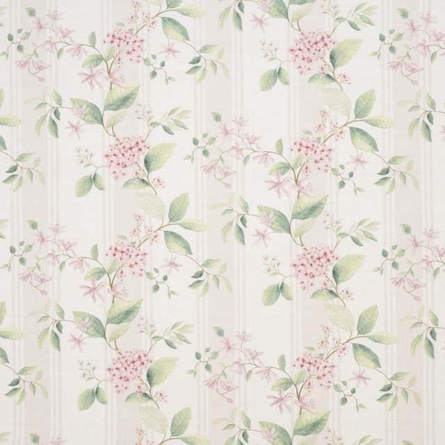Cream embroidered botanical fabric with blush flowers and soft green leaves