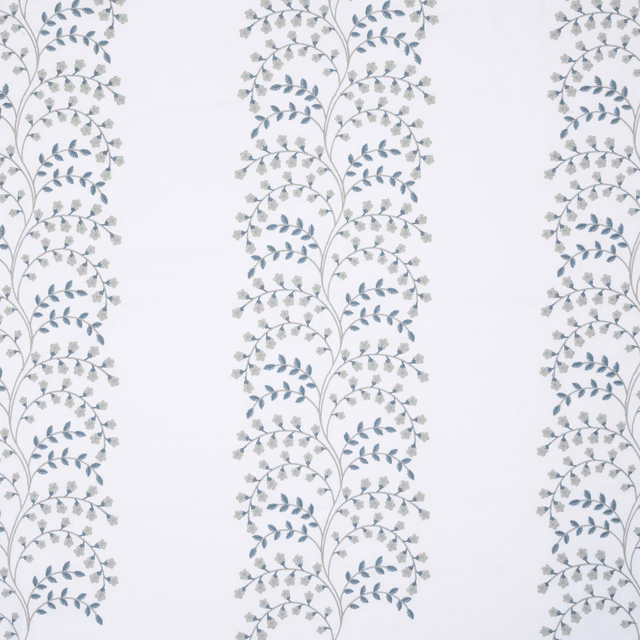 Pale ground fabric with vertical botanical vine stripes in bluestone blue and grey embroidery
