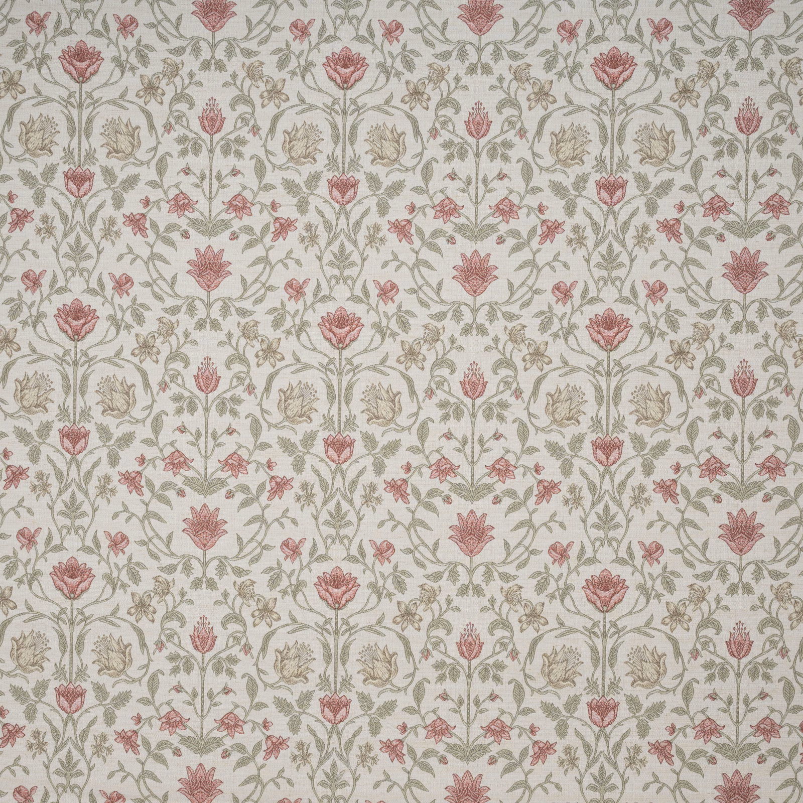 Embroidered floral fabric with dusty rose blooms and sage vine motifs on ivory ground
