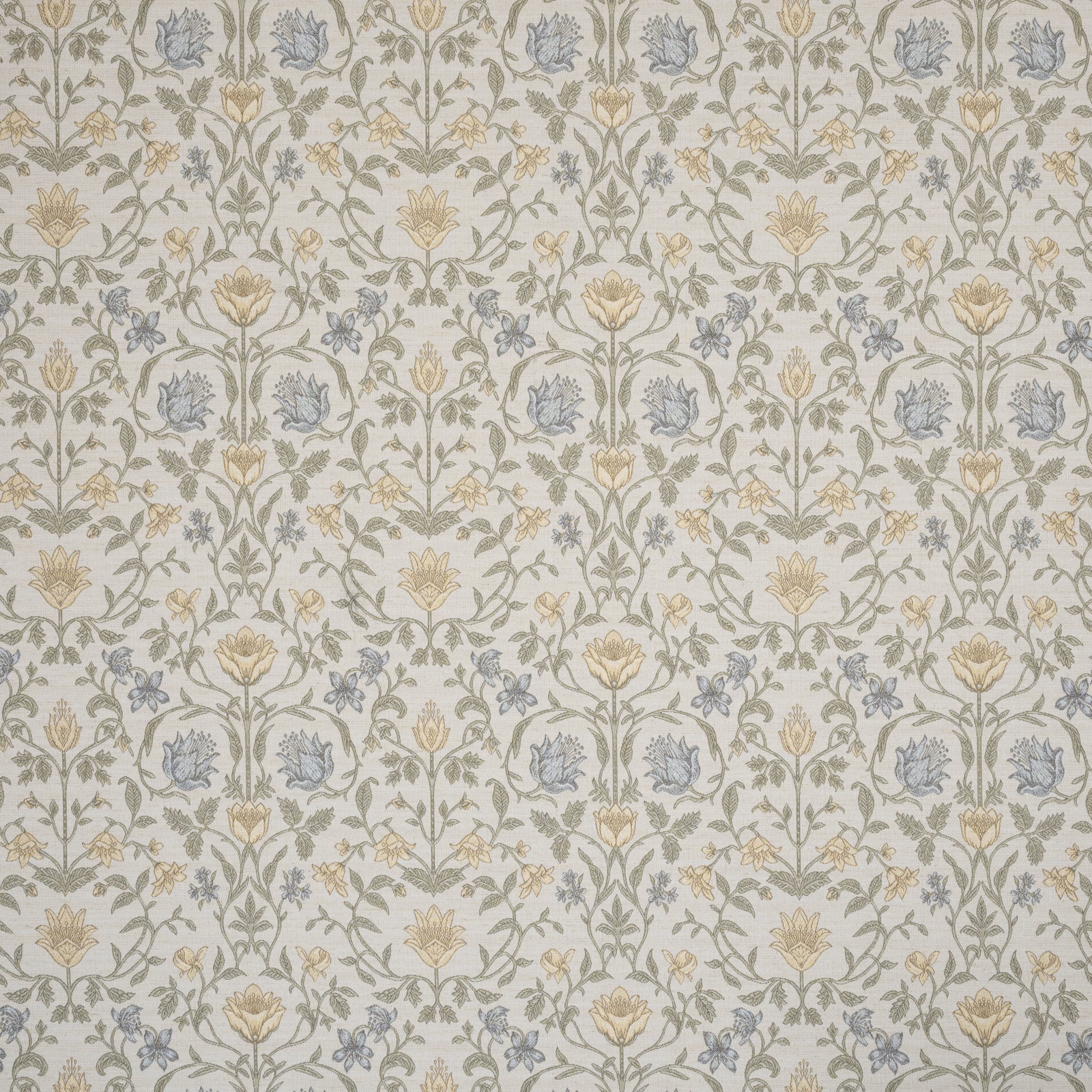 Pale cream embroidered floral fabric with mint green stems and blue blossoms