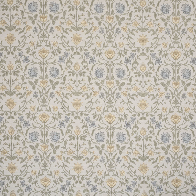 Pale cream embroidered floral fabric with mint green stems and blue blossoms