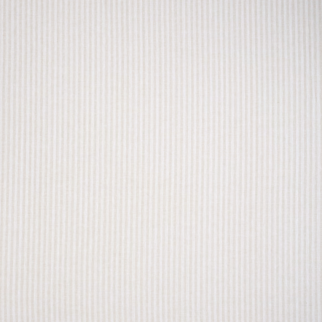 Pale sandstone cream fabric with fine vertical pinstripes and a smooth woven texture
