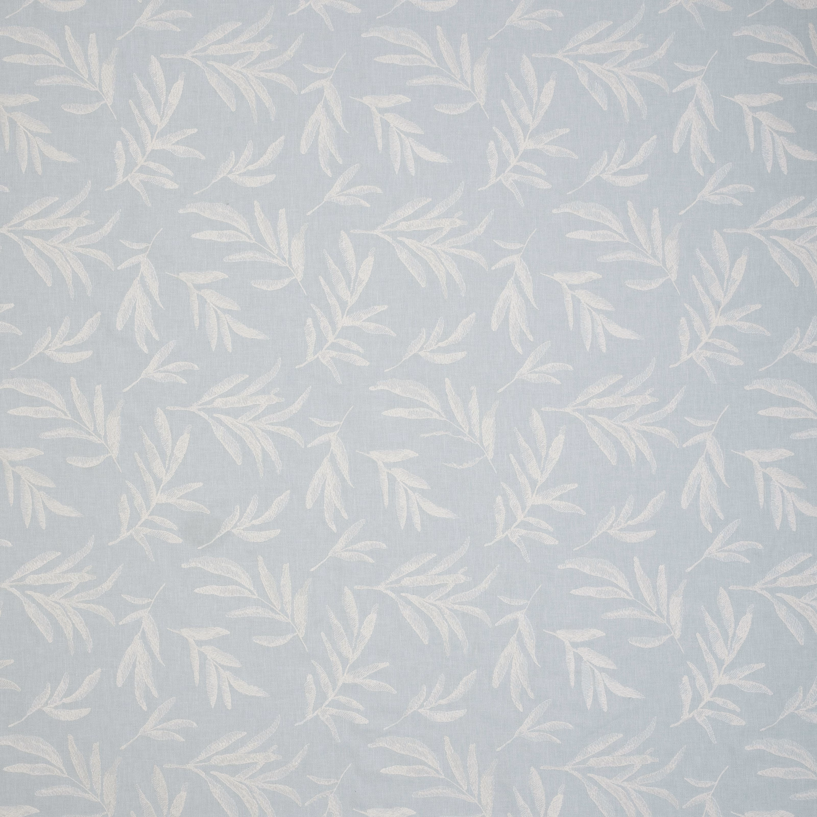 Pale seafoam botanical fabric with soft cream leaf trails and fine woven texture