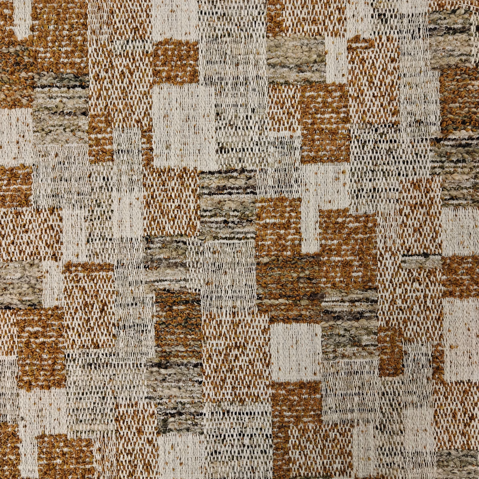 Ochre and stone geometric woven fabric with textured block pattern