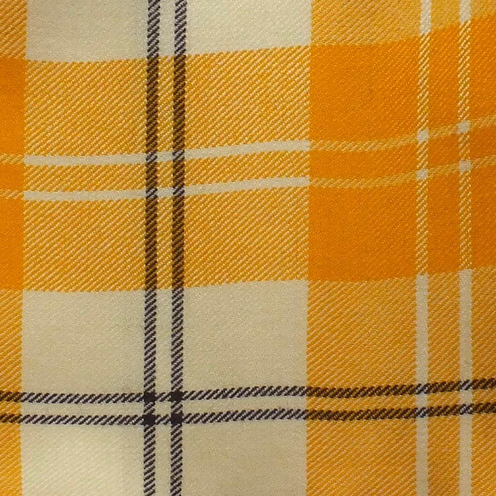 Warm ochre-gold plaid with cream blocks and dark twin stripes in a woven twill