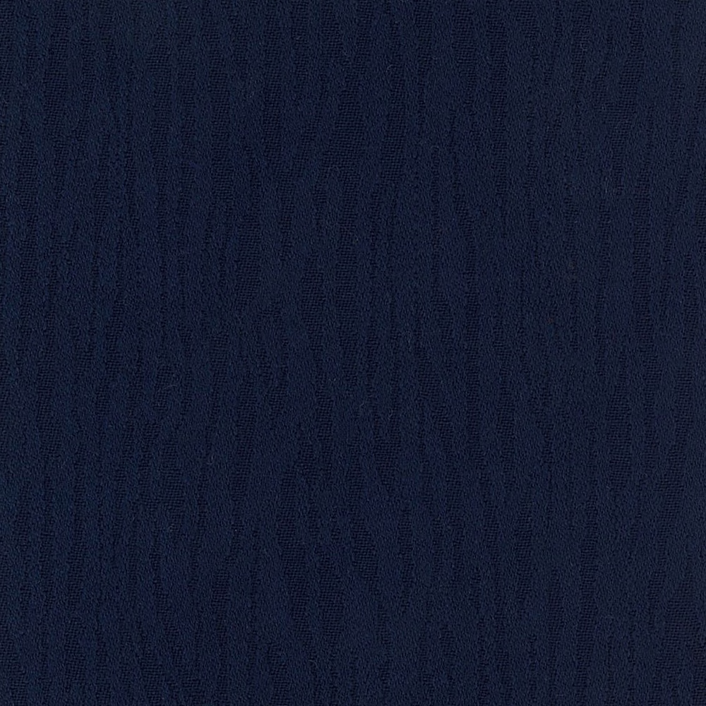 Close view of deep ink-blue cloth with subtle, irregular vertical woven striations