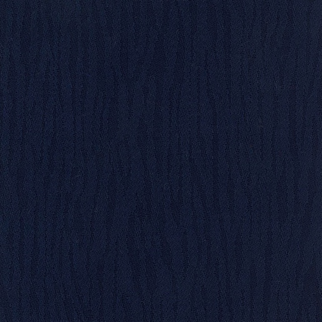 Close view of deep ink-blue cloth with subtle, irregular vertical woven striations