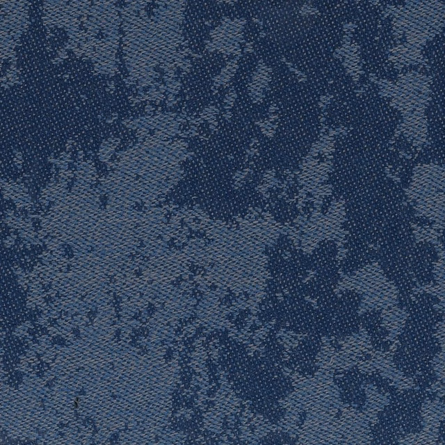 Ink blue woven texture with slate flecks and an abstract mottled pattern