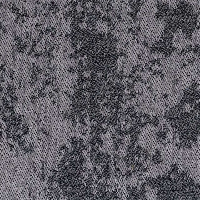 Close-up of grey woven textile with charcoal mottled flecks and slate texture
