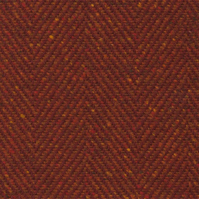 Dark amber-brown woven upholstery with rust, burgundy and fine golden chevron flecks