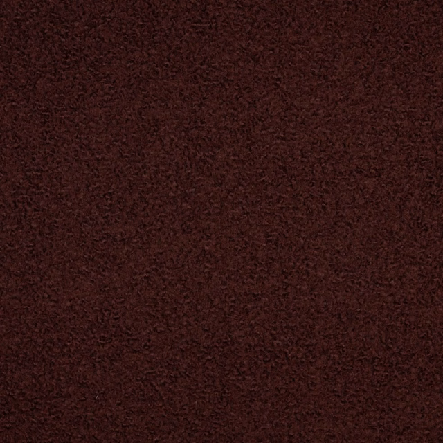 Dark burgundy-brown boucle swatch showing a dense, softly irregular nubby surface