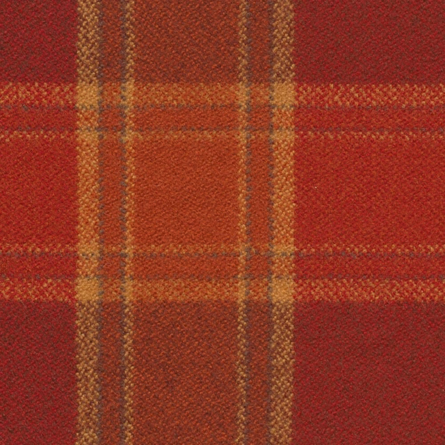 Close view of berry-red check with ochre bands and tactile woven texture