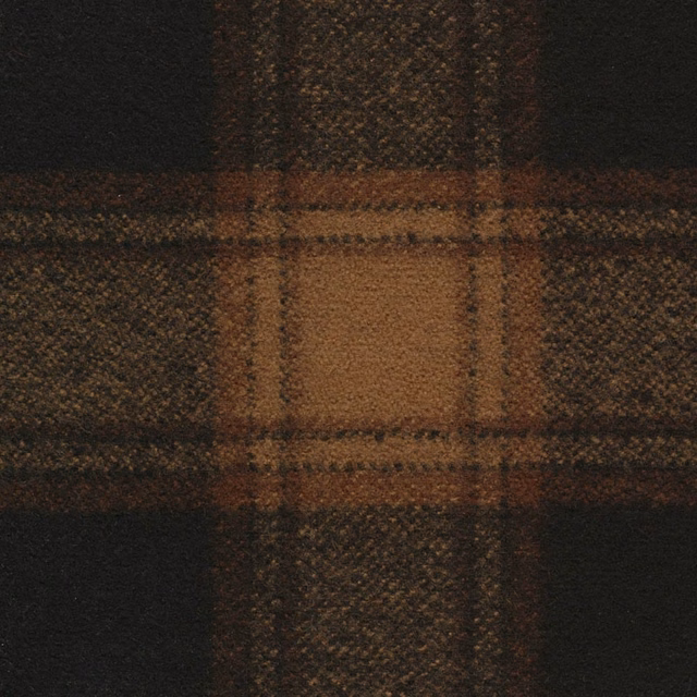 Dense black check textile with russet brown blocks and a softly napped woven texture