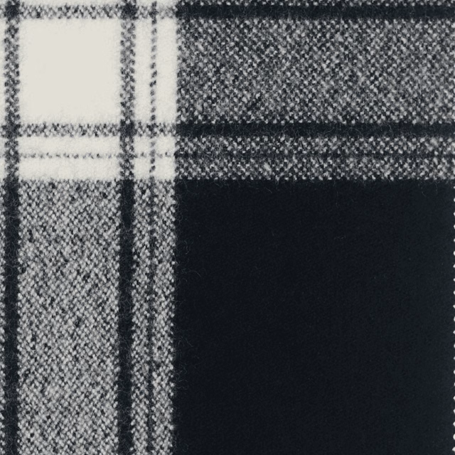 Close view of bold black and white woven check with dense crosshatch texture