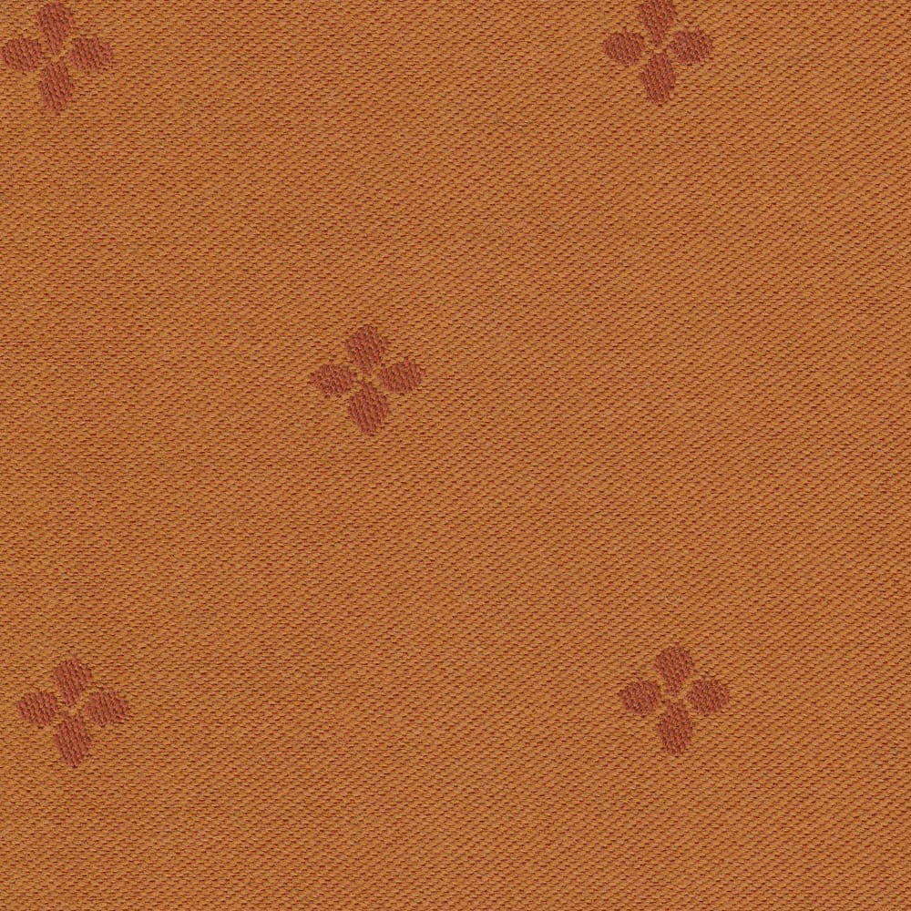 Warm ochre woven fabric with scattered muted burgundy four-petal motifs