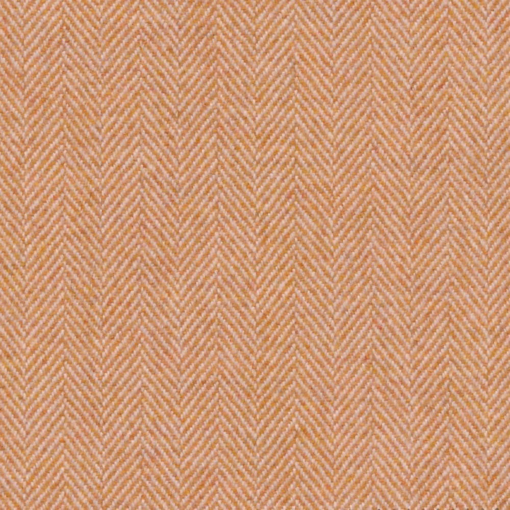 Warm gold herringbone weave with soft peach undertones in close-up