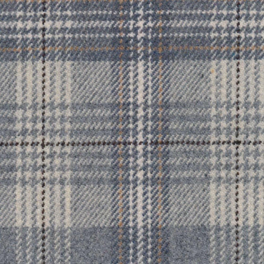 Close-up of muted blue-grey plaid with cream bands and warm tan lines