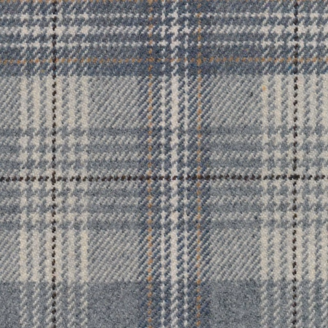 Close-up of muted blue-grey plaid with cream bands and warm tan lines