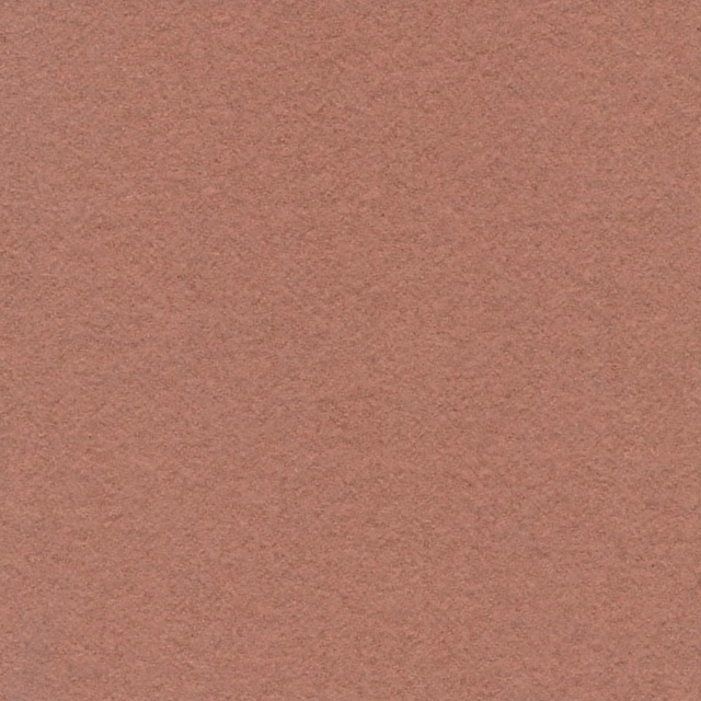 Close-up of warm rose-buff fabric with a soft, mottled low-pile texture