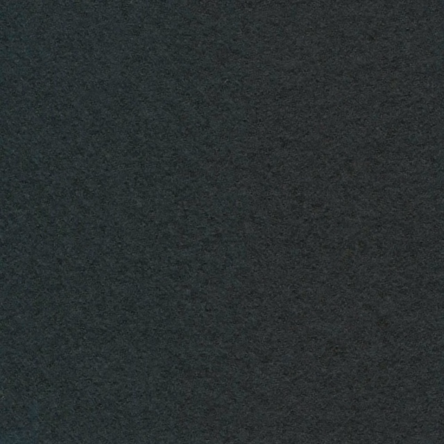 Close-up of a near-black charcoal textile with a soft, mottled surface