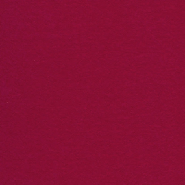 Close-up of saturated magenta fabric with a softly brushed, low-lustre surface