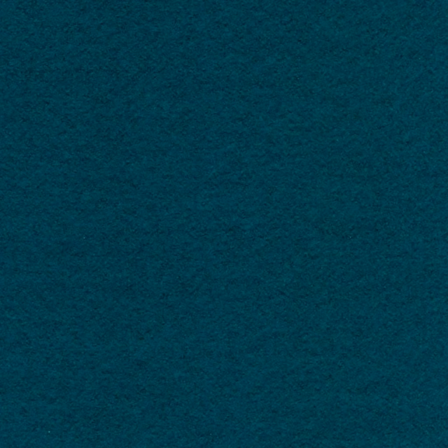 Close-up of deep ocean teal fabric with a softly mottled, tactile surface