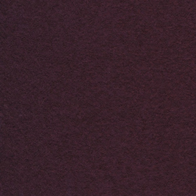 Deep plum fabric with softly mottled, tactile texture and subtle burgundy-purple variation