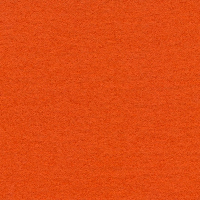 Close view of softly textured saturated tangerine-orange plain fabric surface