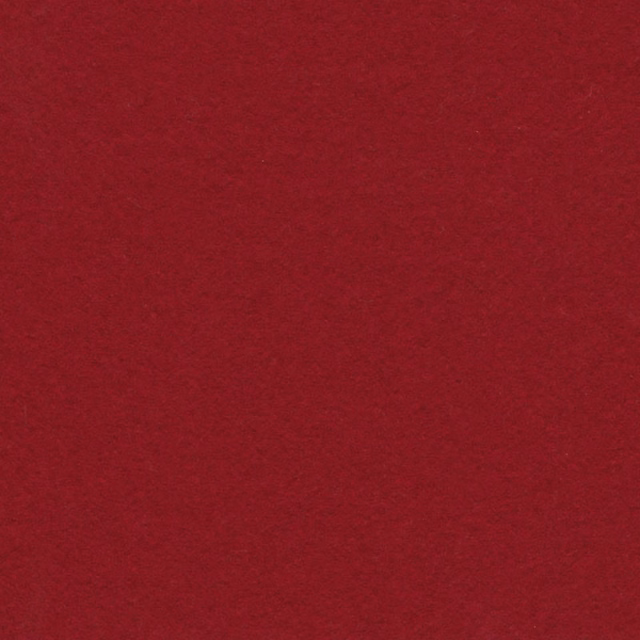 Close-up of deep zinfandel-red fabric with a soft, subtly mottled surface