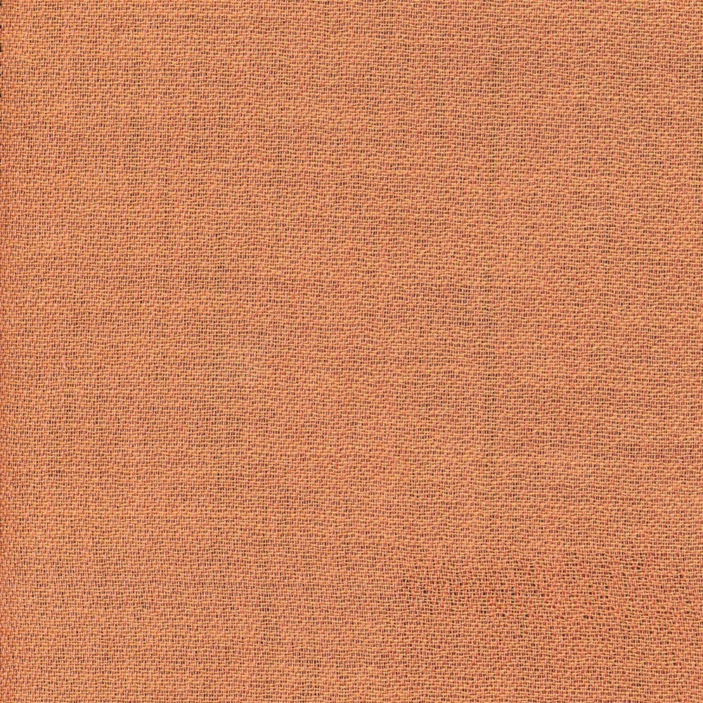 Close-up of muted terracotta fabric with a fine, even crossweave