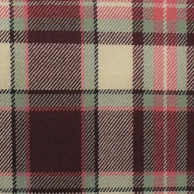 Close-up of burgundy tartan with black, ivory, sage and muted pink checks