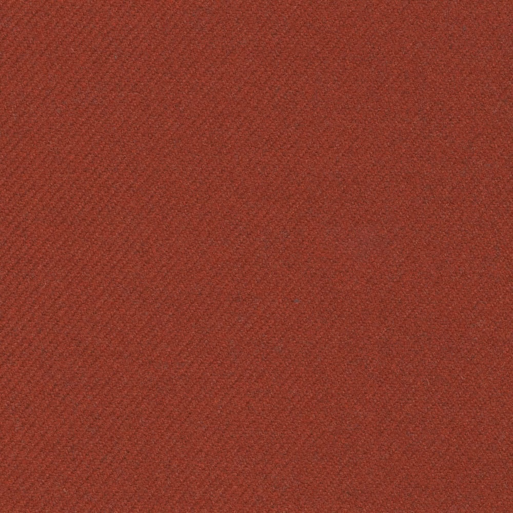 Close-up of dark amber russet fabric with a fine diagonal woven texture