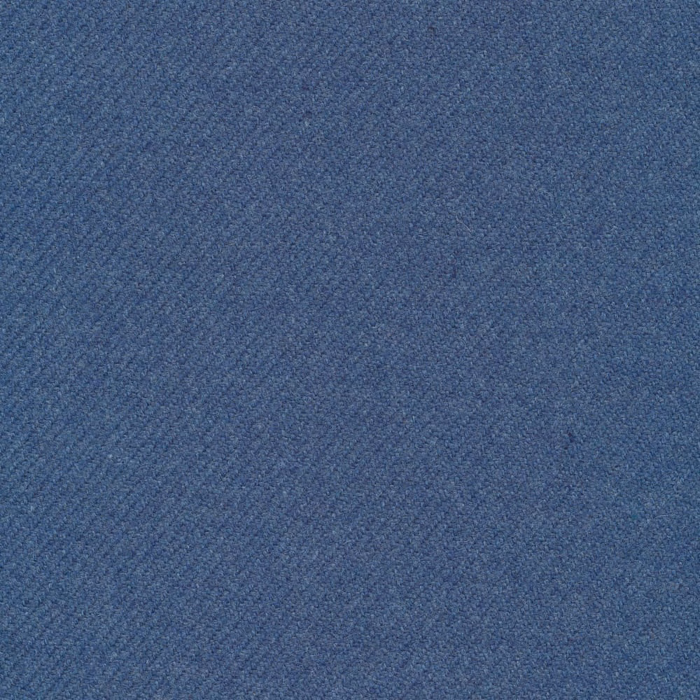 Muted denim-blue twill with a softly flecked, fine woven surface
