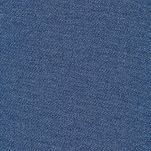 Muted denim-blue twill with a softly flecked, fine woven surface
