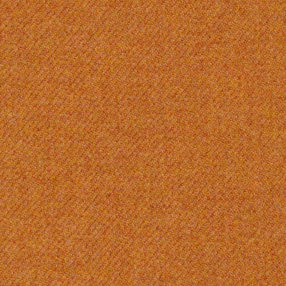 Close-up of warm heather-gold nubby weave with orange and ochre flecks