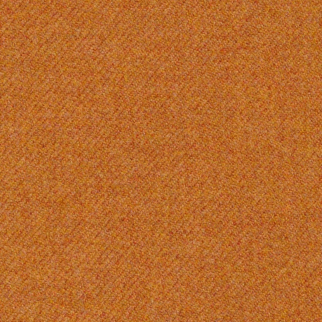 Close-up of warm heather-gold nubby weave with orange and ochre flecks