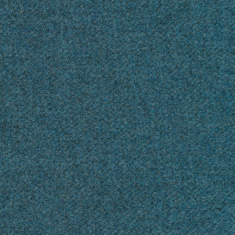 Close-up of mottled blue-teal woven upholstery with charcoal and turquoise flecks