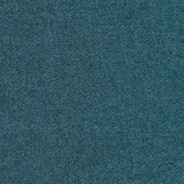 Close-up of mottled blue-teal woven upholstery with charcoal and turquoise flecks