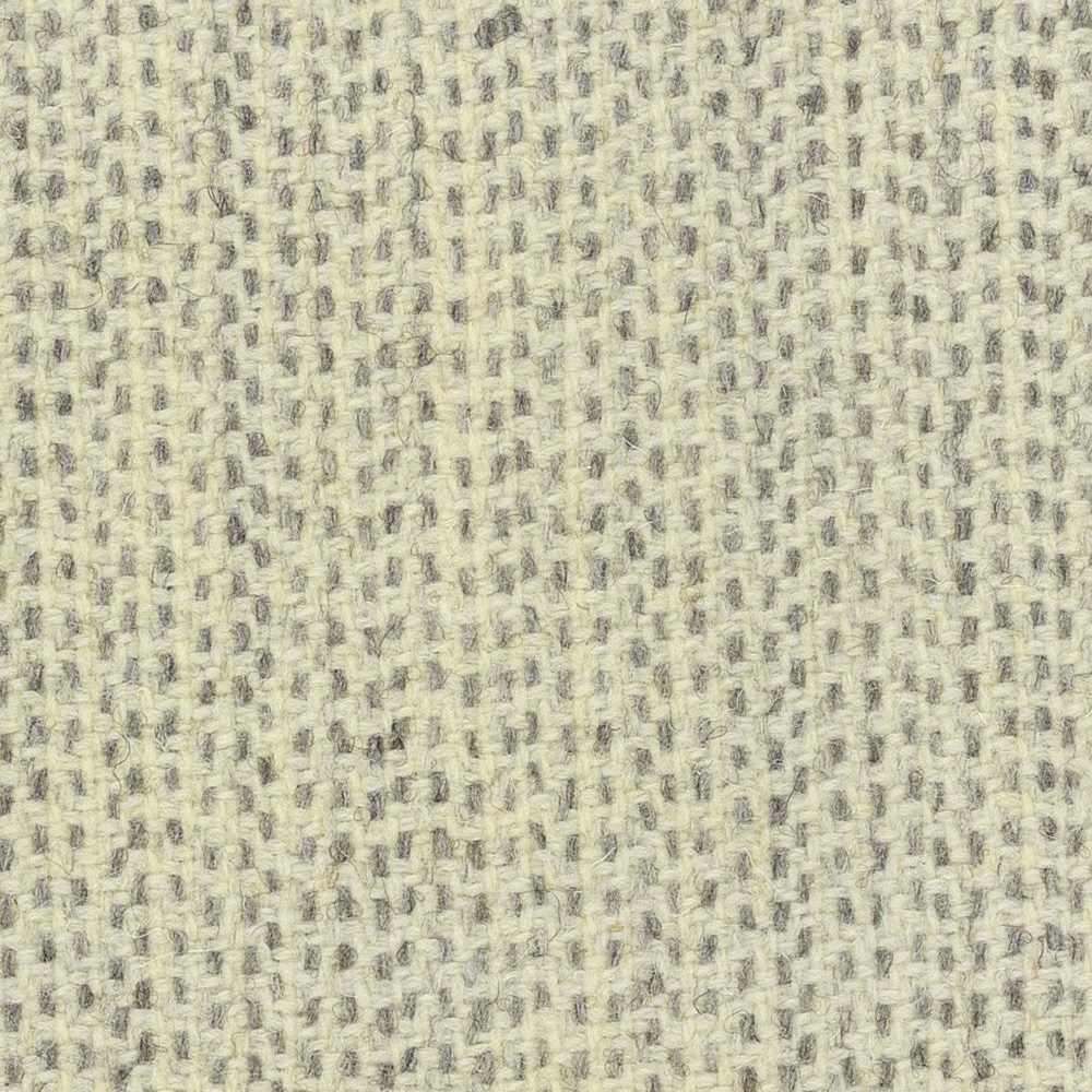 Pale cream nubby woven fabric with scattered soft grey flecks and tactile texture