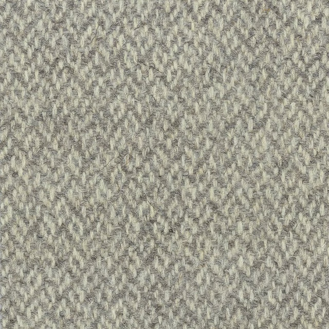 Pale stone-grey woven textile with broken herringbone texture and ivory flecks