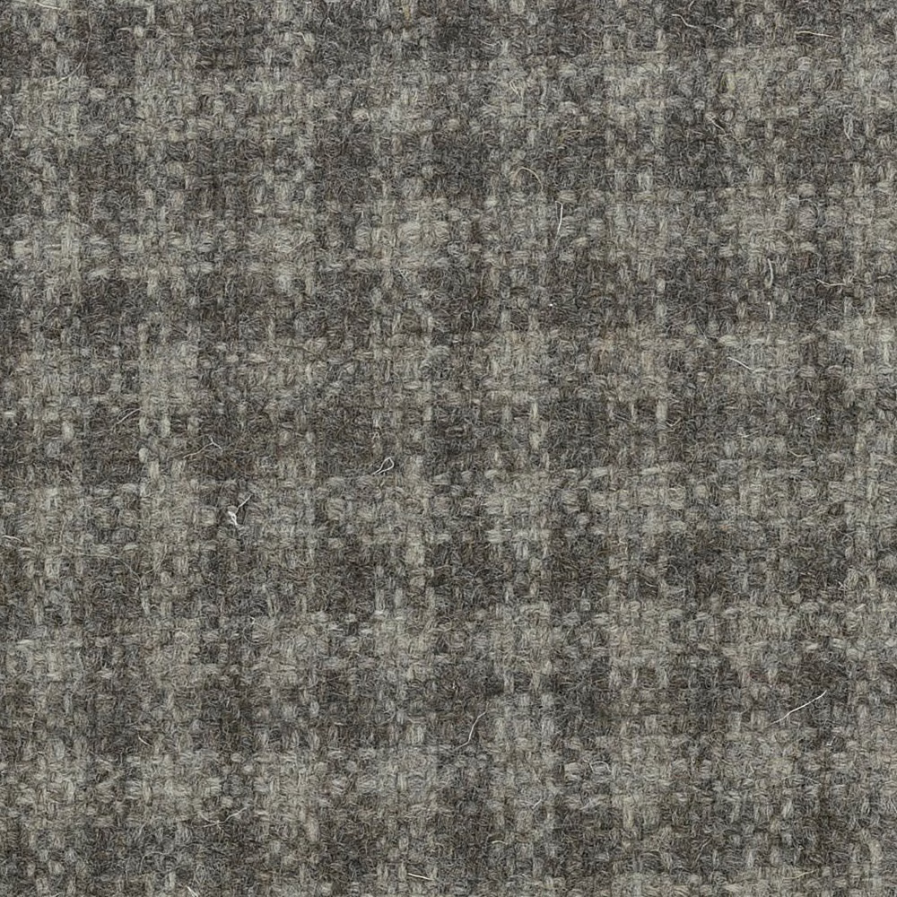 Weathered charcoal-grey undyed wool weave with pale and brown flecks