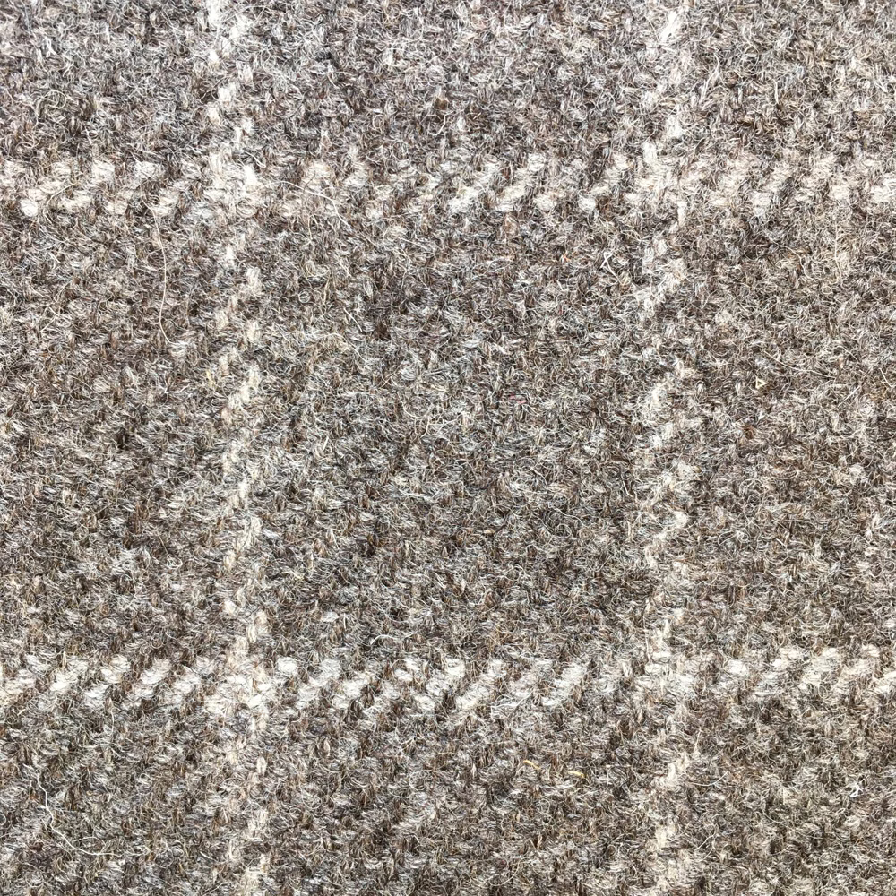 Close-up of taupe-grey undyed-looking weave with cream flecks and diagonal texture