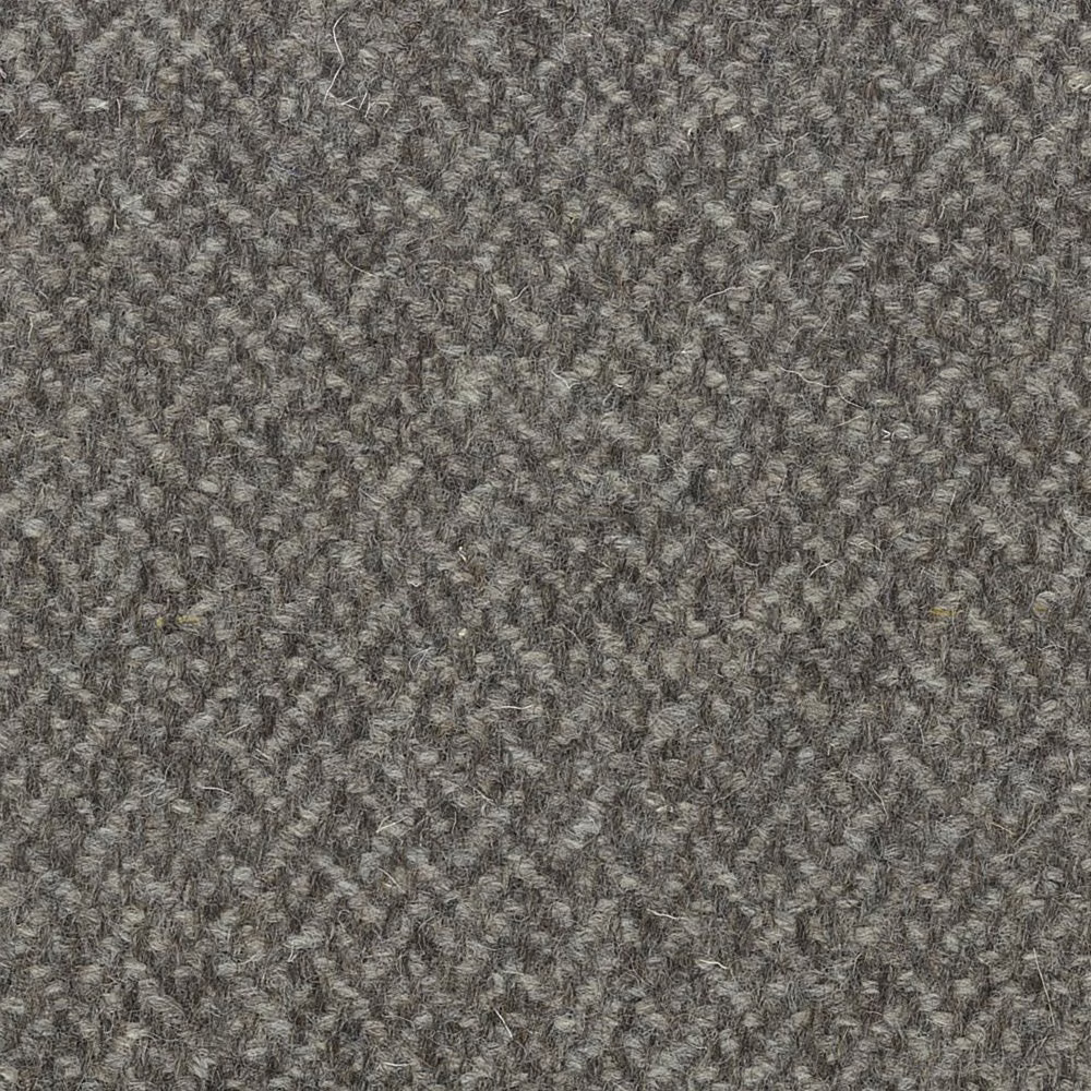 Mottled warm-grey nubby textile with charcoal, taupe and silvery flecks