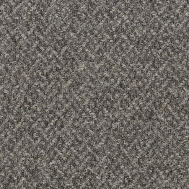 Mottled warm-grey nubby textile with charcoal, taupe and silvery flecks