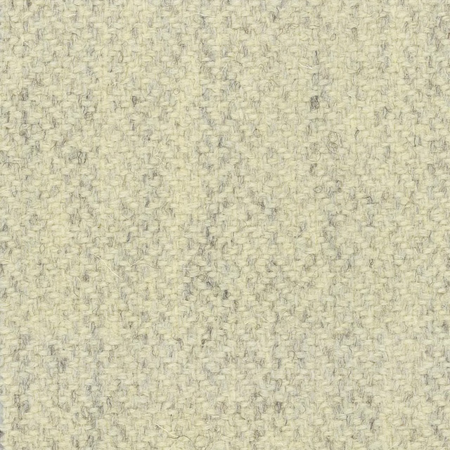 Pale oatmeal cream textile with fine grey flecks and irregular woven texture
