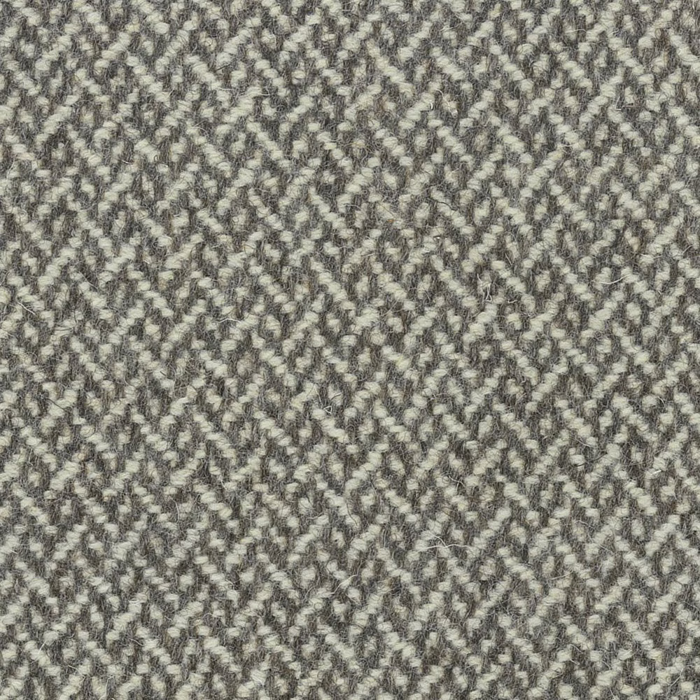 Mottled stone-grey fabric with pale flecks and small broken-chevron weave