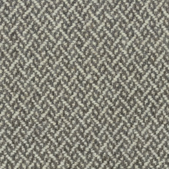 Mottled stone-grey fabric with pale flecks and small broken-chevron weave