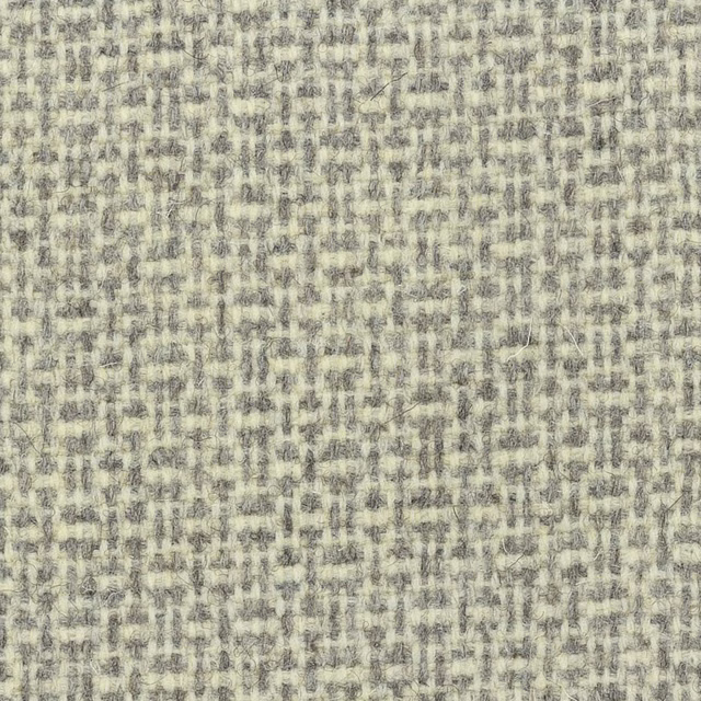 Pale oatmeal-grey wool weave with mottled flecks and small irregular checked texture