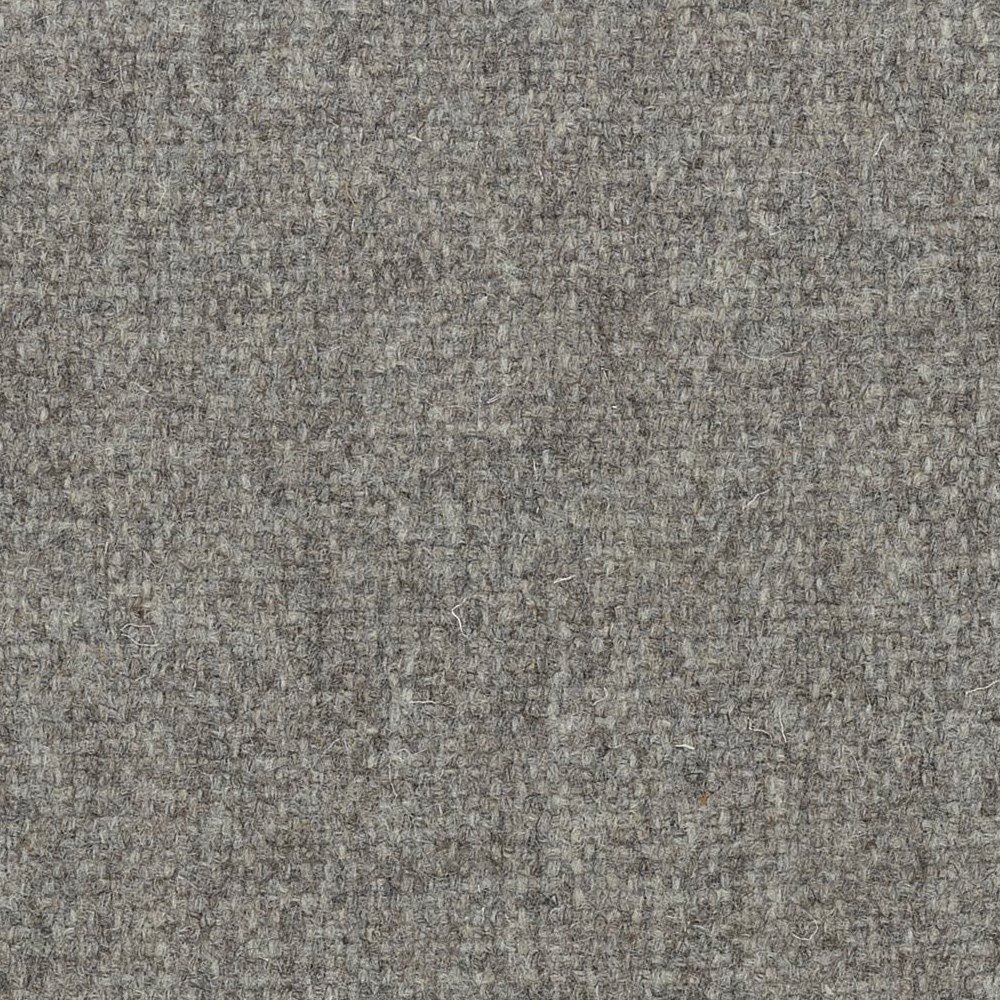 Dense undyed taupe-grey wool weave with irregular brown and grey flecks